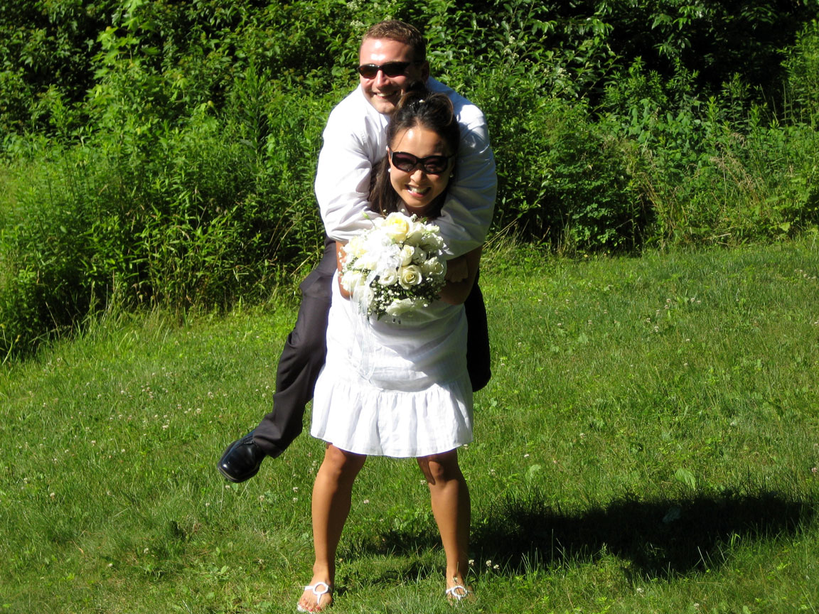 Picture of bride carrying groom.
